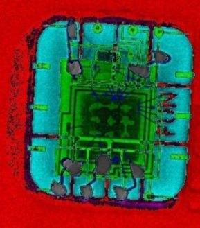 An artificially colored x-ray image showing the FUN chip and the green stolen credit card chip soldered to it.